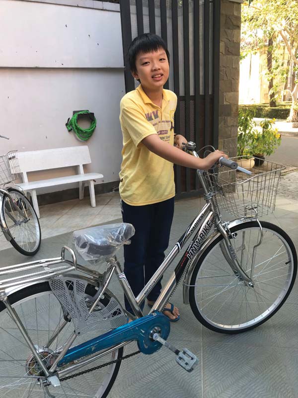 Binh with his new bicycle.