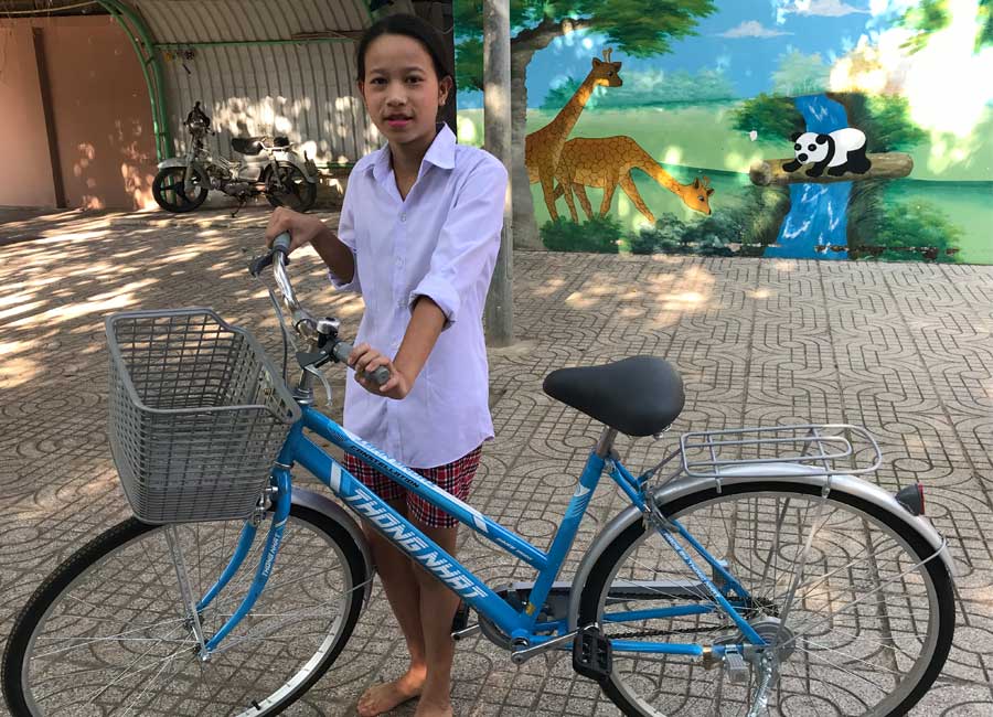 Thu with her new bicycle.