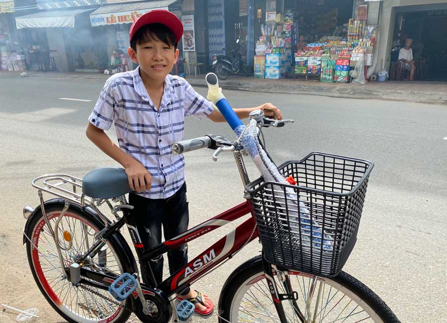 Bao with his new bicycle.