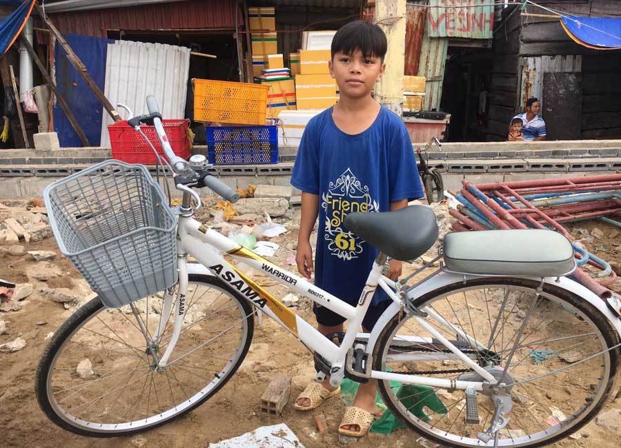 Bao with his new bicycle.