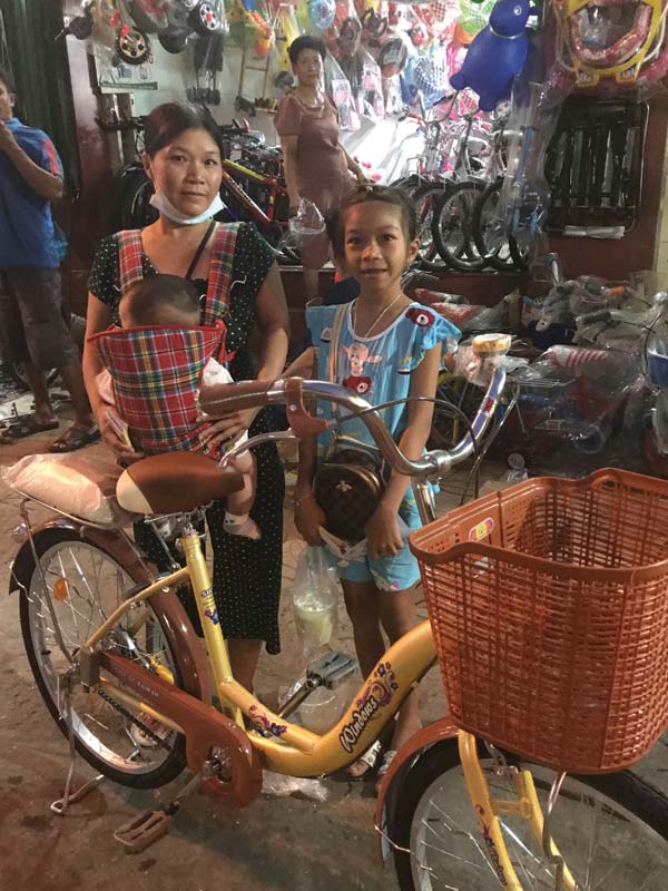 Mai with her new bicycle.