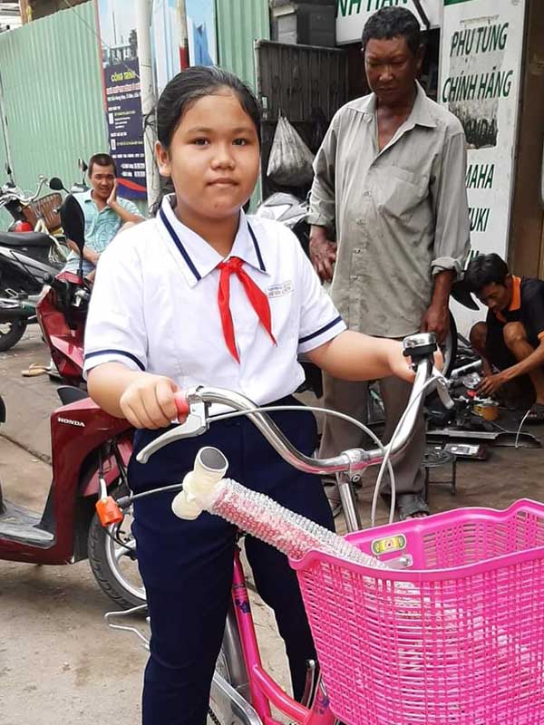 Ngoc with her new bicycle.