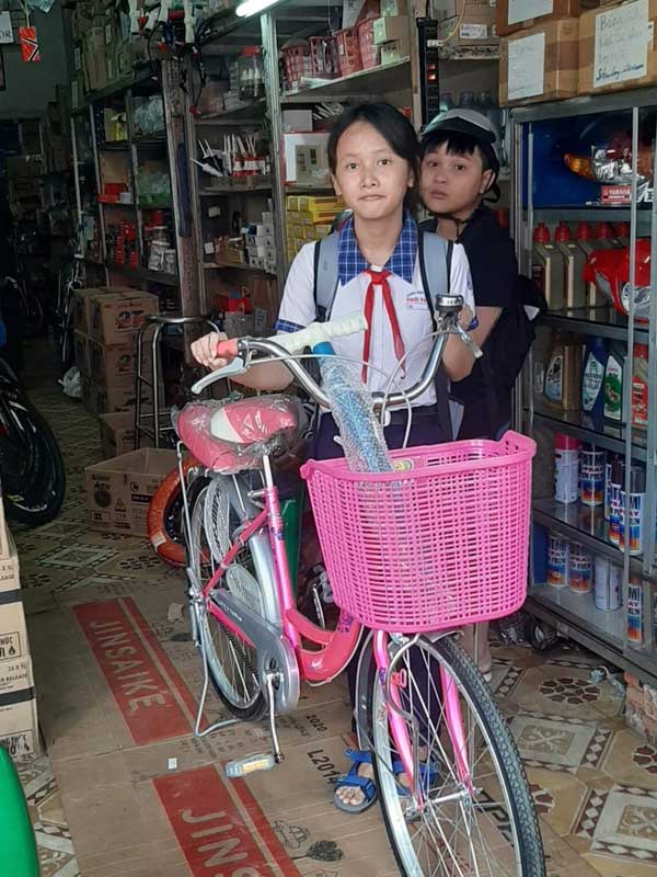 Phuong with her new bicycle.