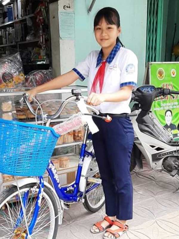 Vy with her new bicycle.