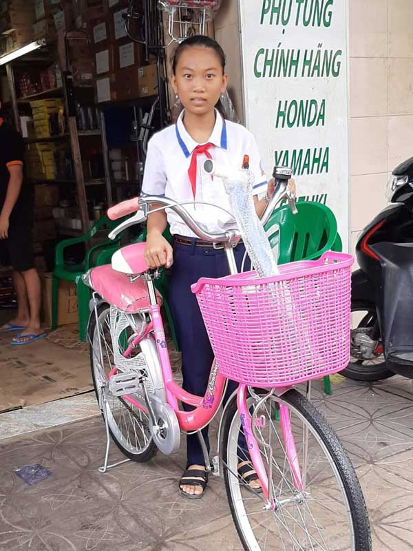 Yen with her new bicycle.